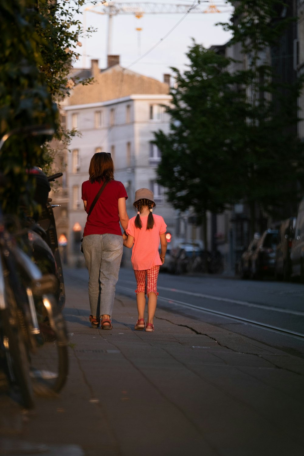 two women walking down a street