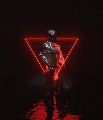 A model wearing layered techwear with reflective surfaces, standing beneath a neon sign flickering in the night.