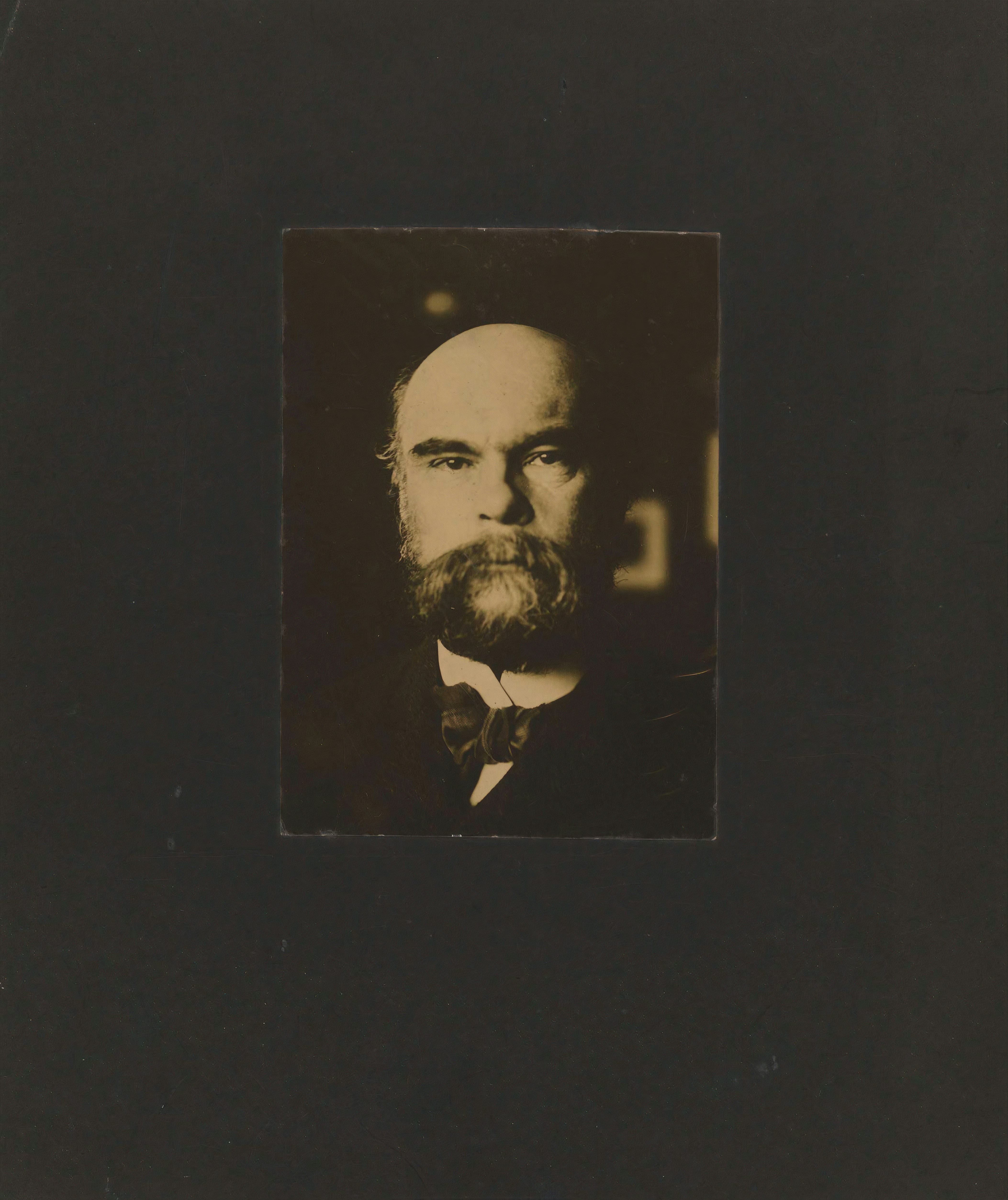 a man's head in a black background