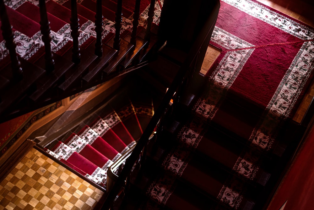 a staircase with red and white tiles