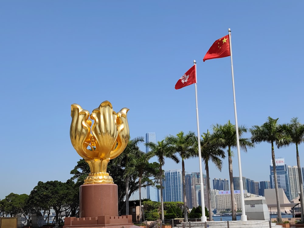 a golden trophy with flags in the background