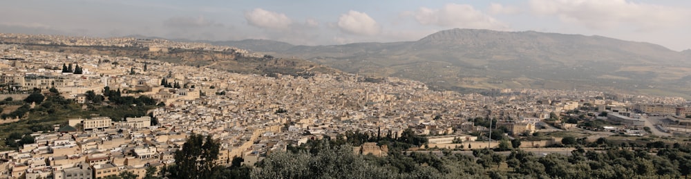 a city with mountains in the background