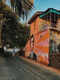 Close-up of a local artist painting a mural that brightens a downtown Sumter wall.