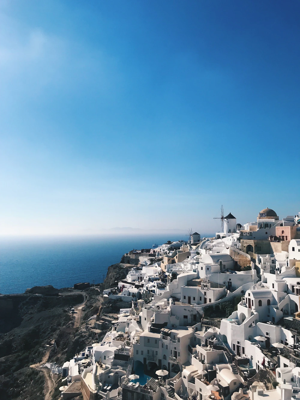Whitewashed buildings overlooking the blue Aegean Sea in Santorini, Greece