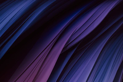 Abstract close-up of rich textures in midnight navy and warm slate, reflecting quiet luxury.