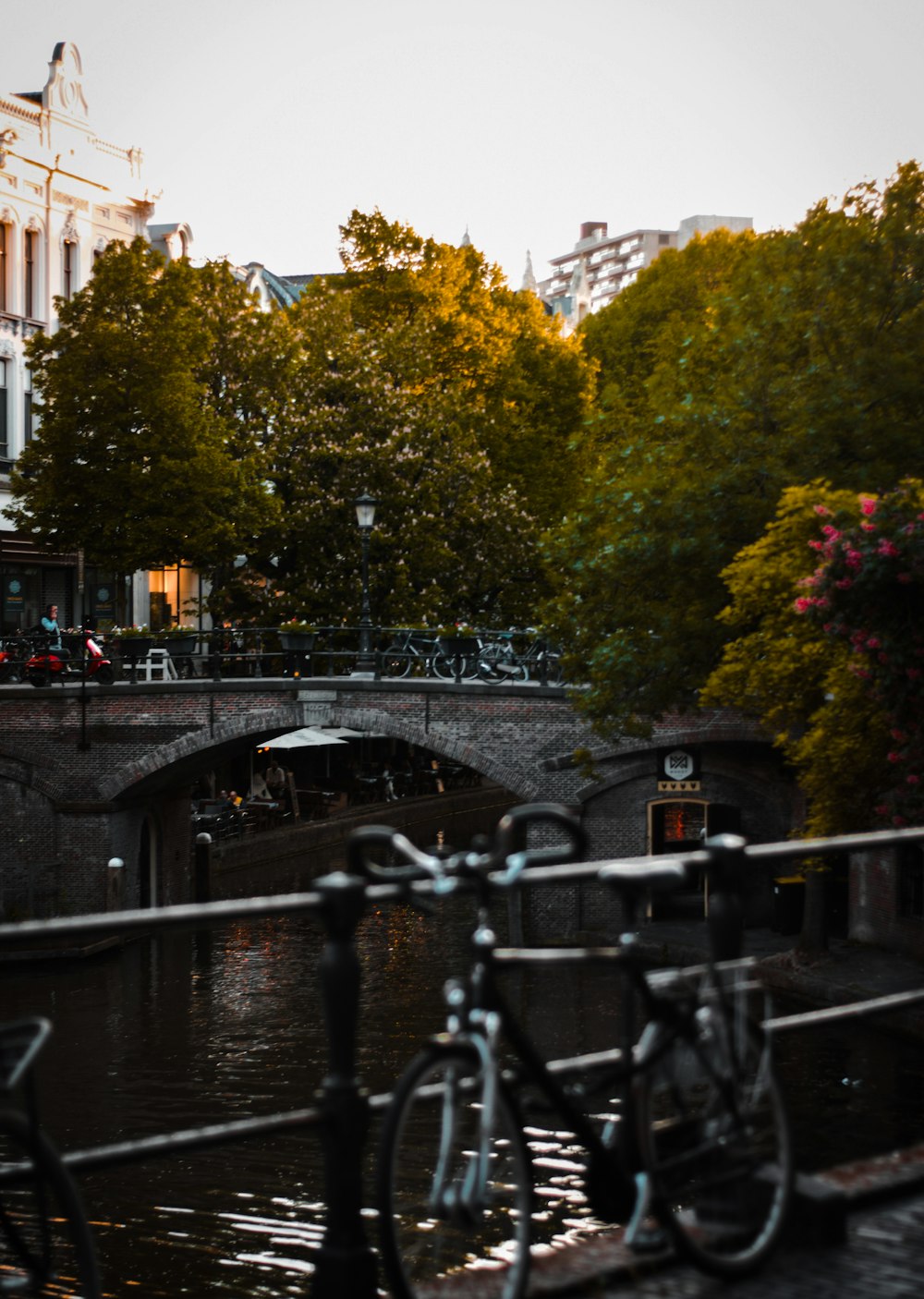 a bicycle parked on a bridge