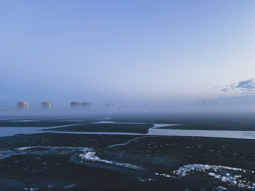 a beach with ice and snow