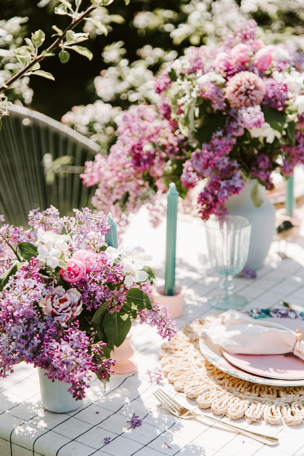 a table with flowers and plates