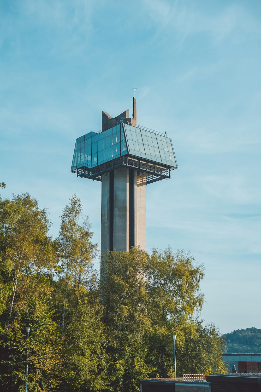 a tall tower with trees around it