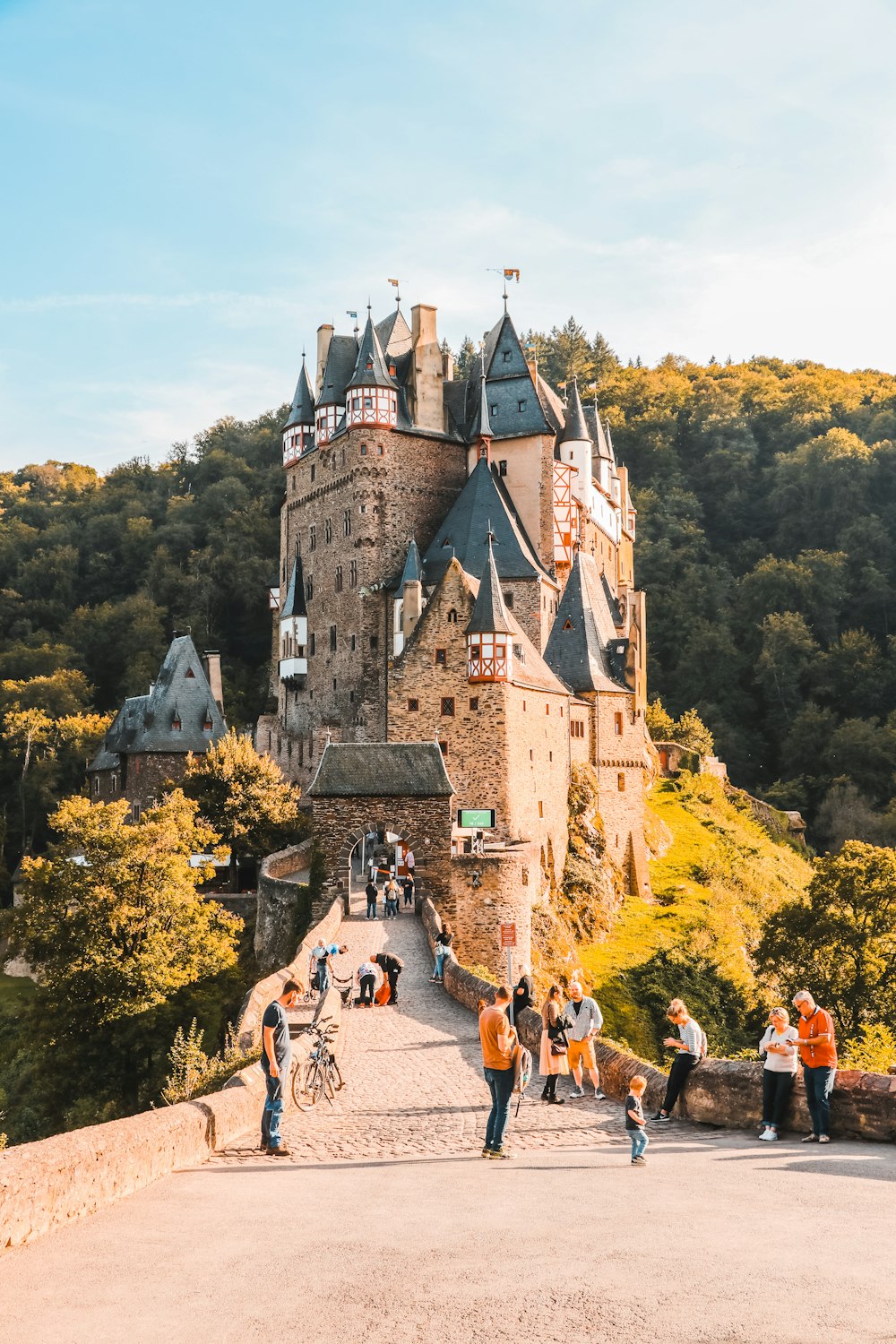 a castle with a group of people walking around