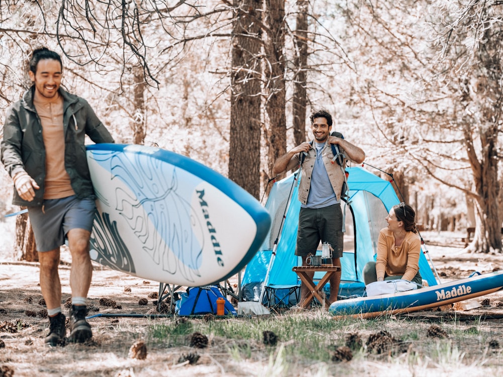 a couple of men with surfboards