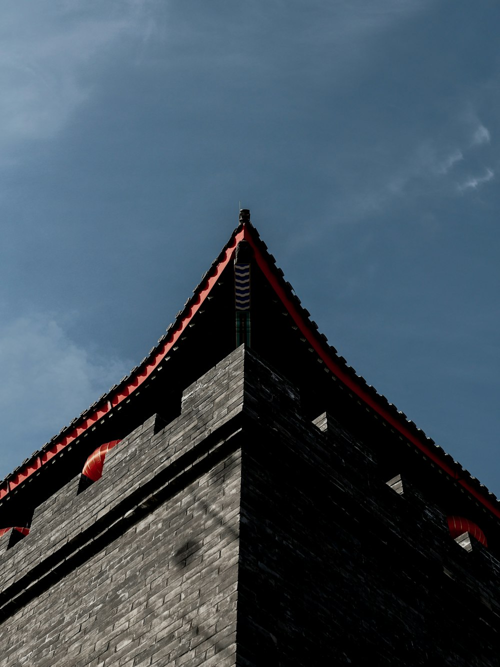 a tall building with a red roof