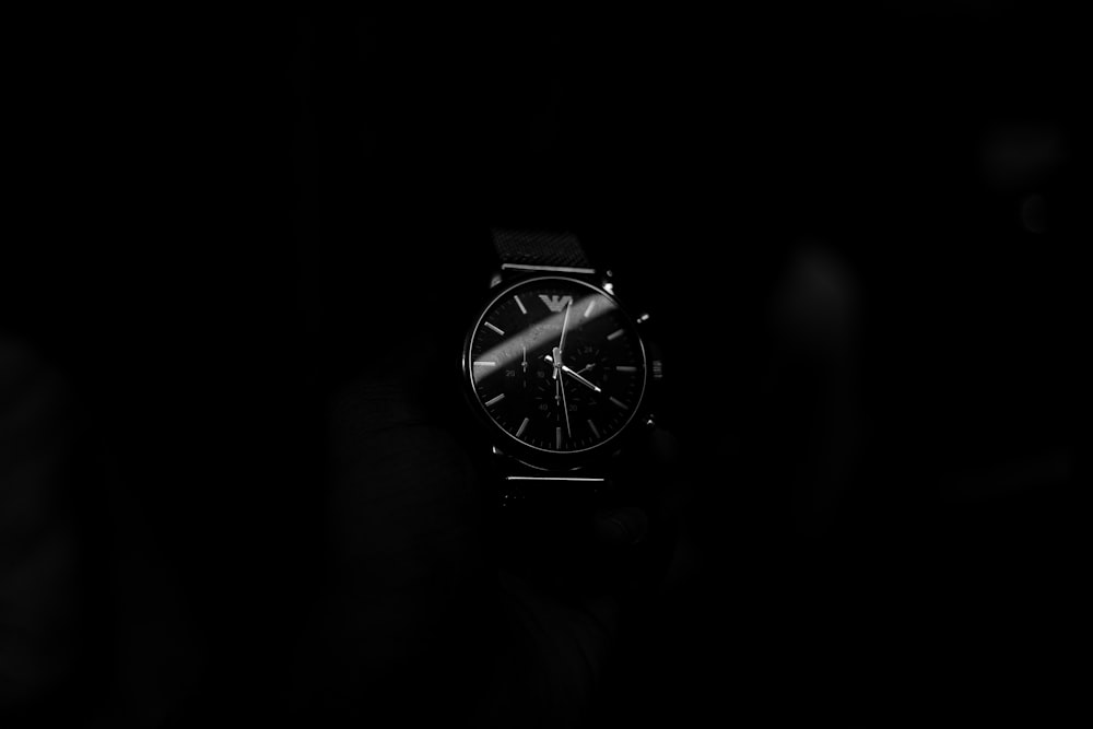 a watch on a black background