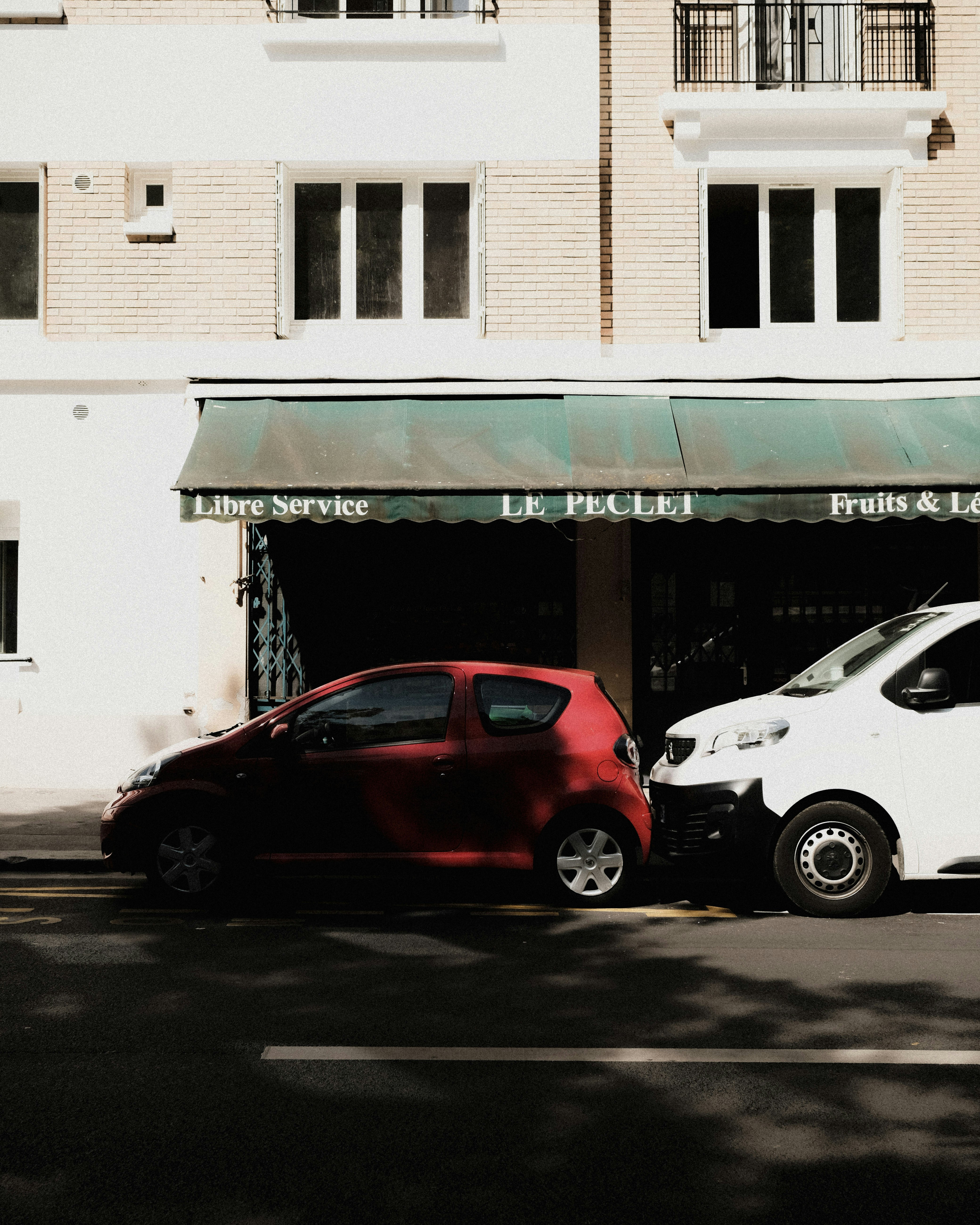 a couple of cars parked outside a building