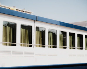 A compact mobile office unit with large windows and a clean, professional interior.