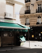 A group of neighbors organizing a crowdfunding event to reopen their neighborhood épicerie.