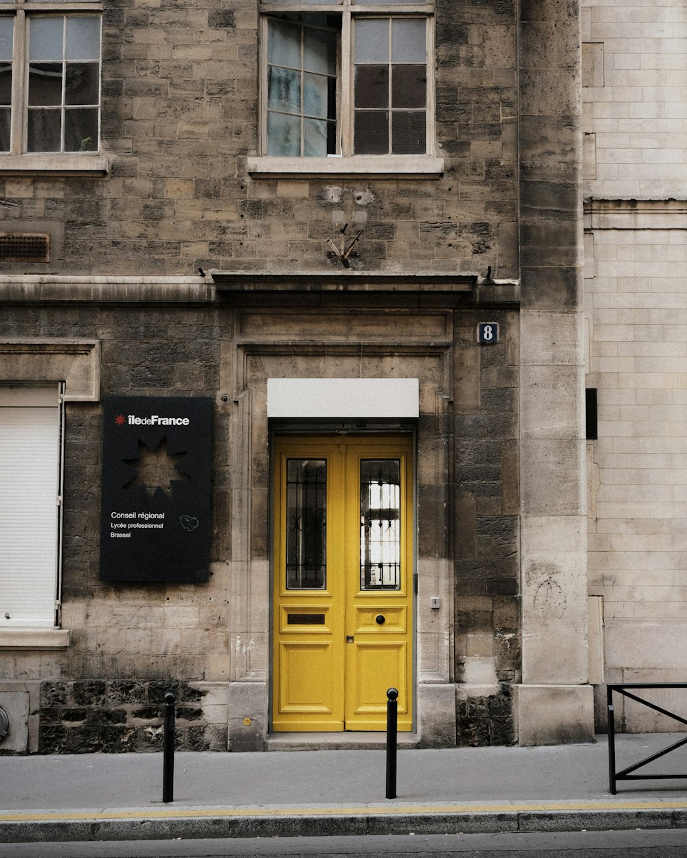 a building with a yellow door