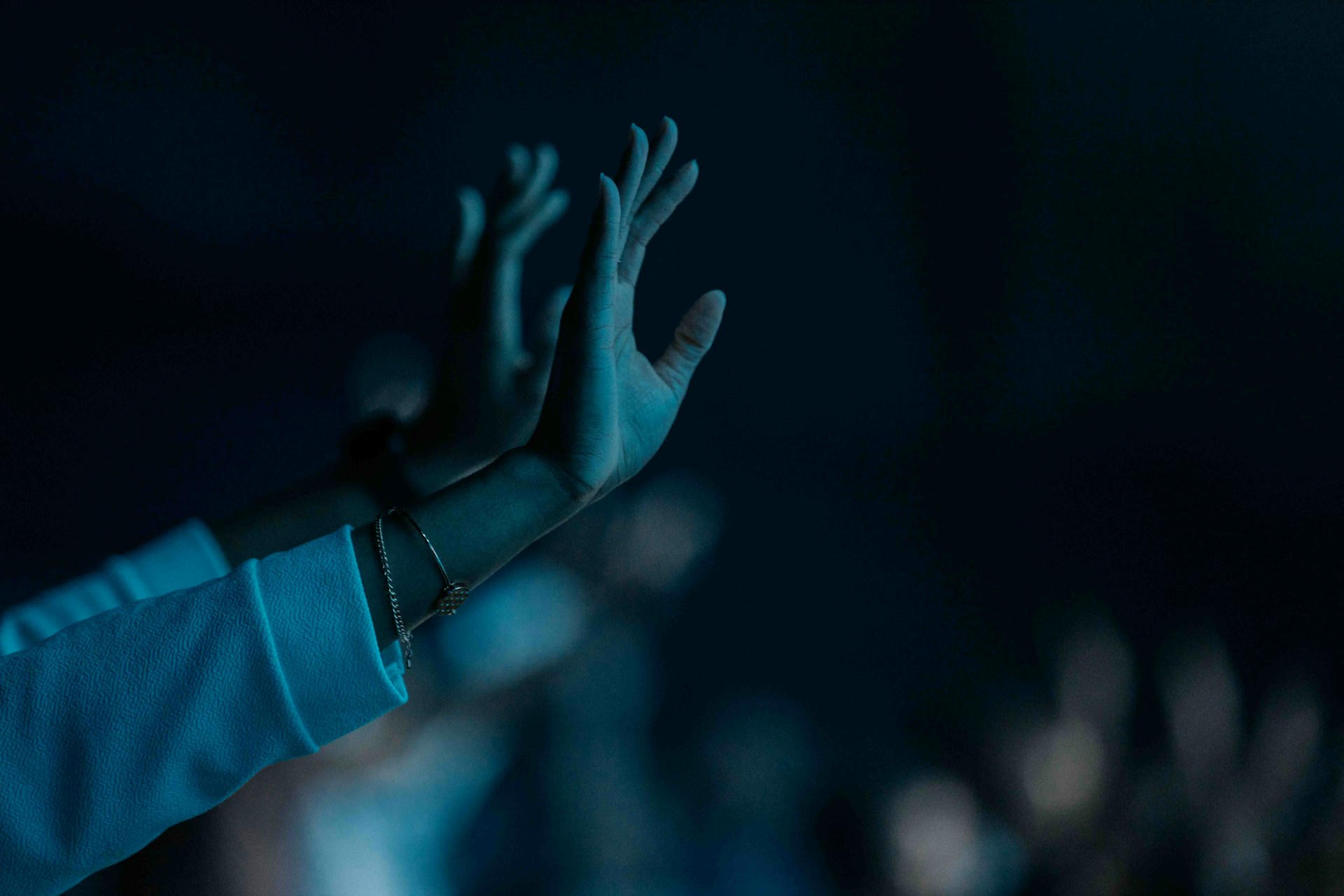 a hand with a blue background