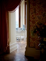 A cozy home corner decorated with artificial flowers and elegant vases
