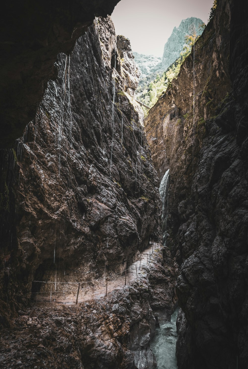 a cave with a waterfall