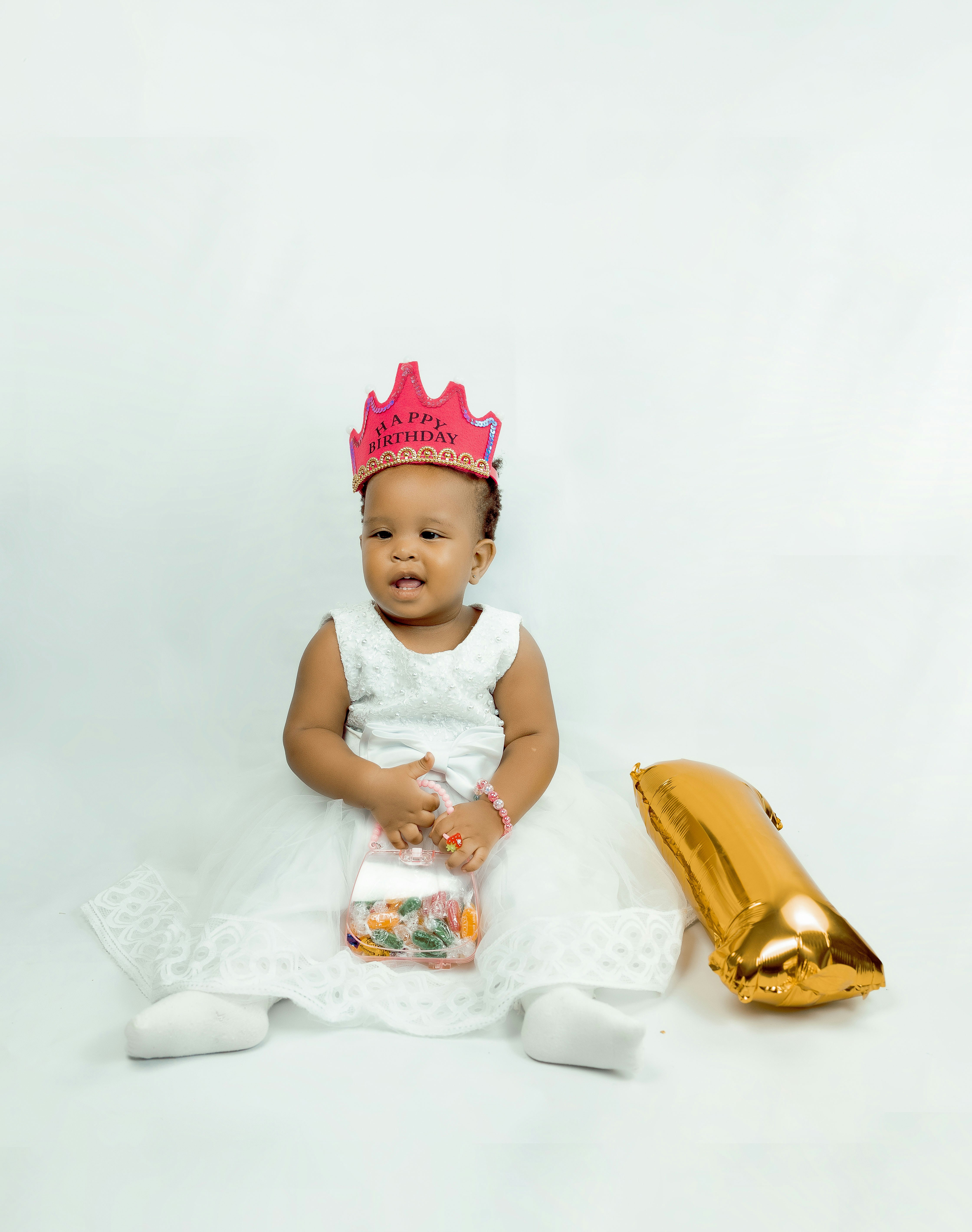 a baby sitting on a blanket