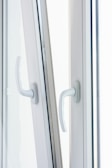 Close-up of a durable aluminum window hinge and handle.