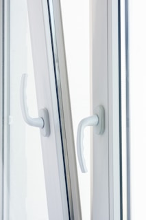 Close-up of a new energy-efficient window locking securely with a modern handle.