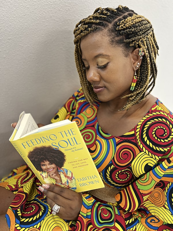 African American mother reading with child