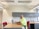 A person sitting at a desk, working on a laptop.