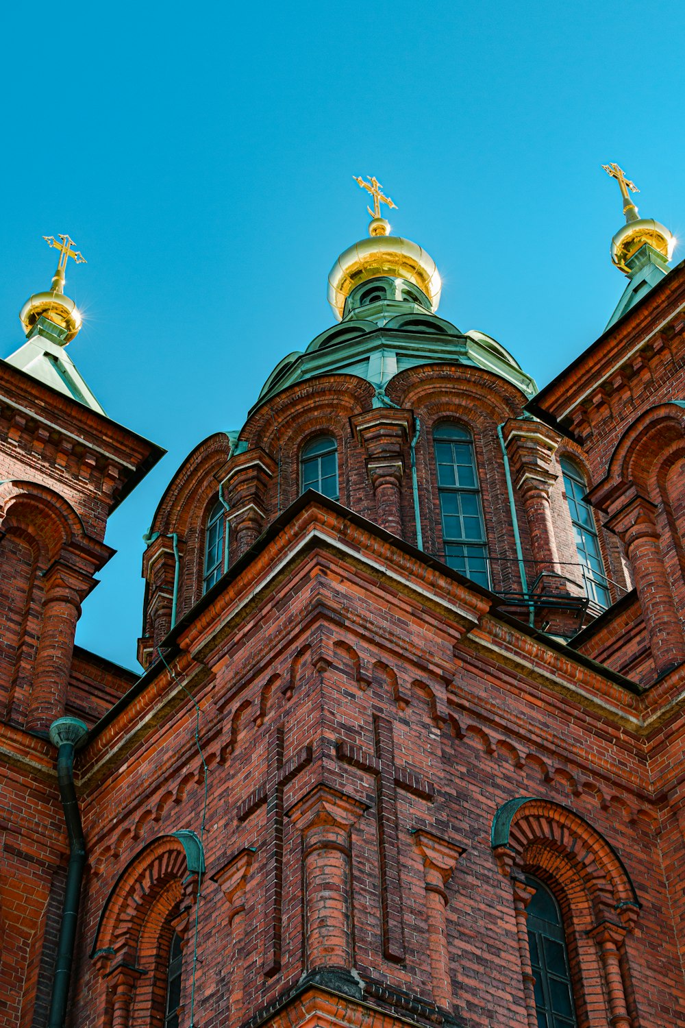 a building with a gold statue on top