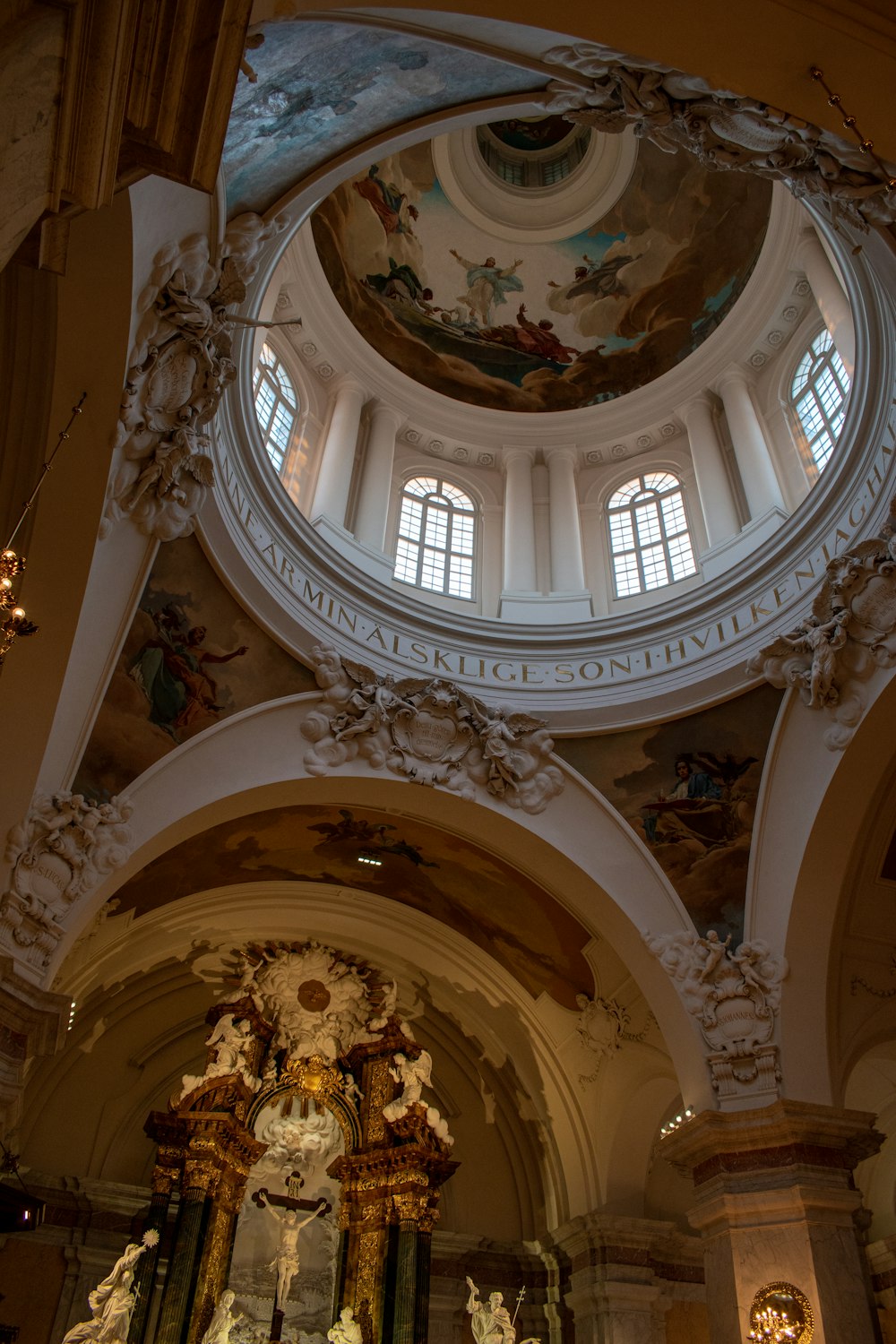 a large ornate ceiling with statues