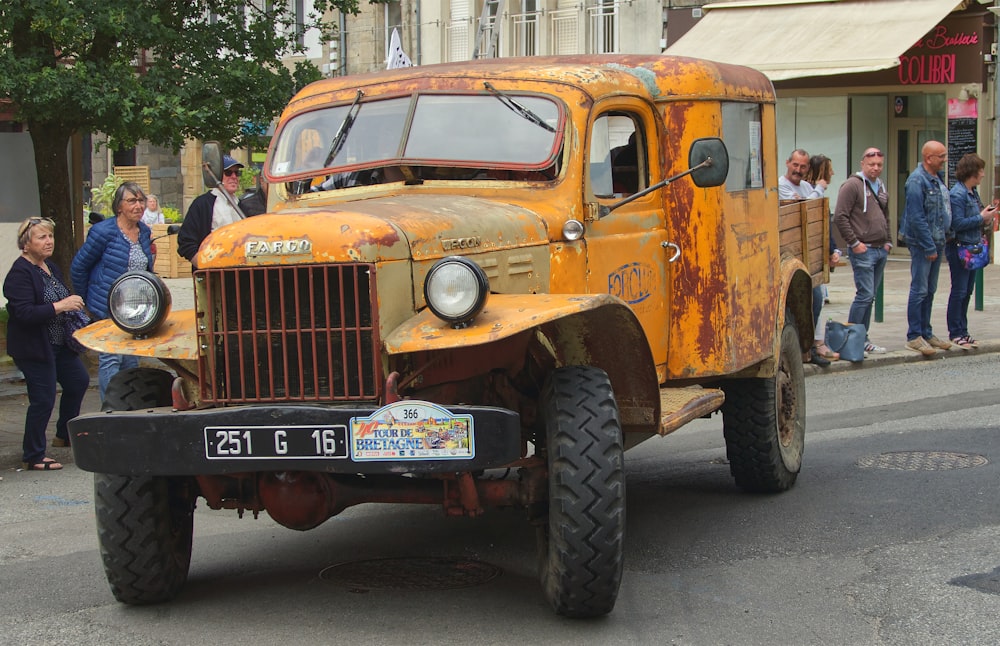 a yellow truck on the street