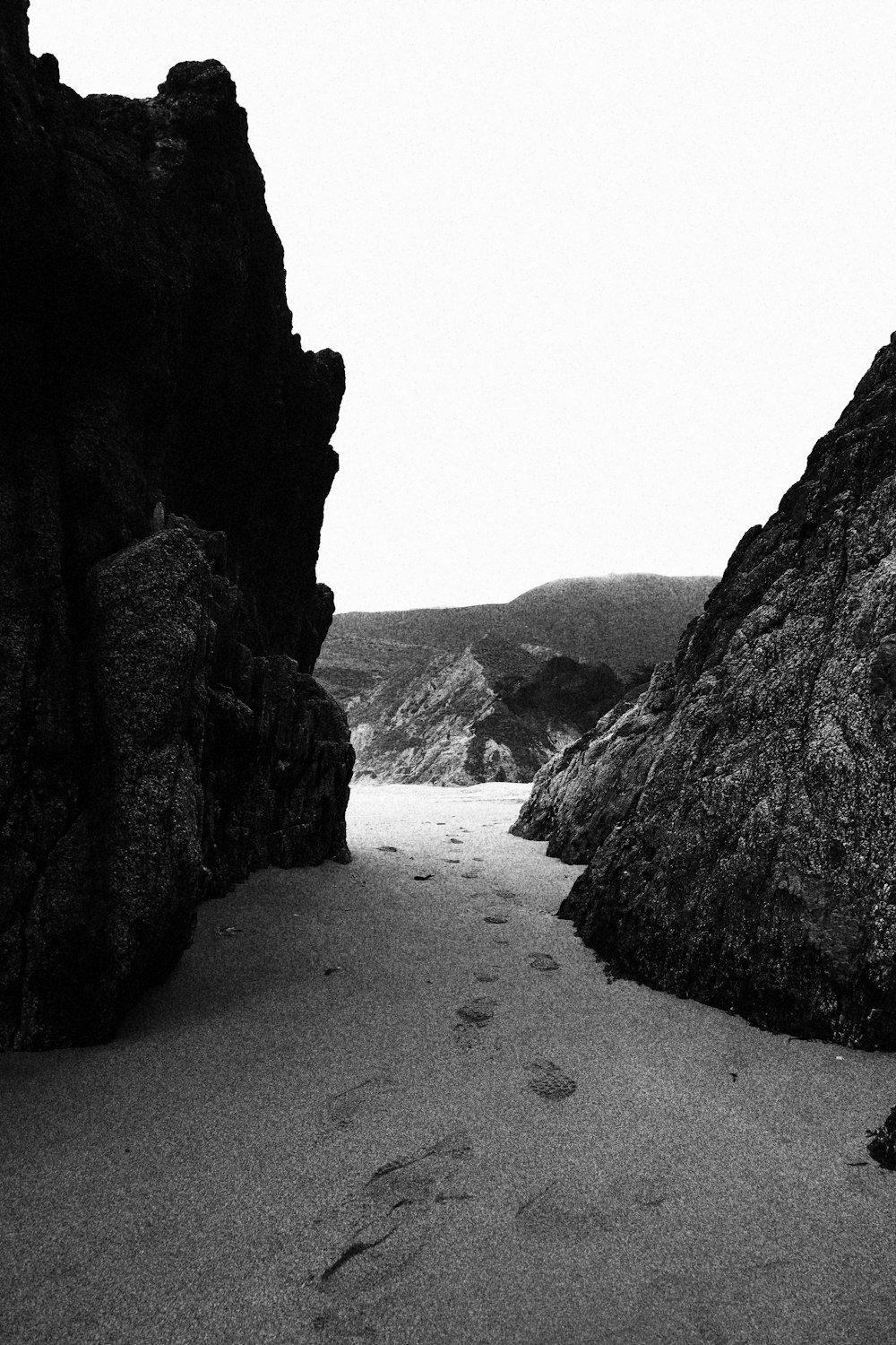 a road between large rocks