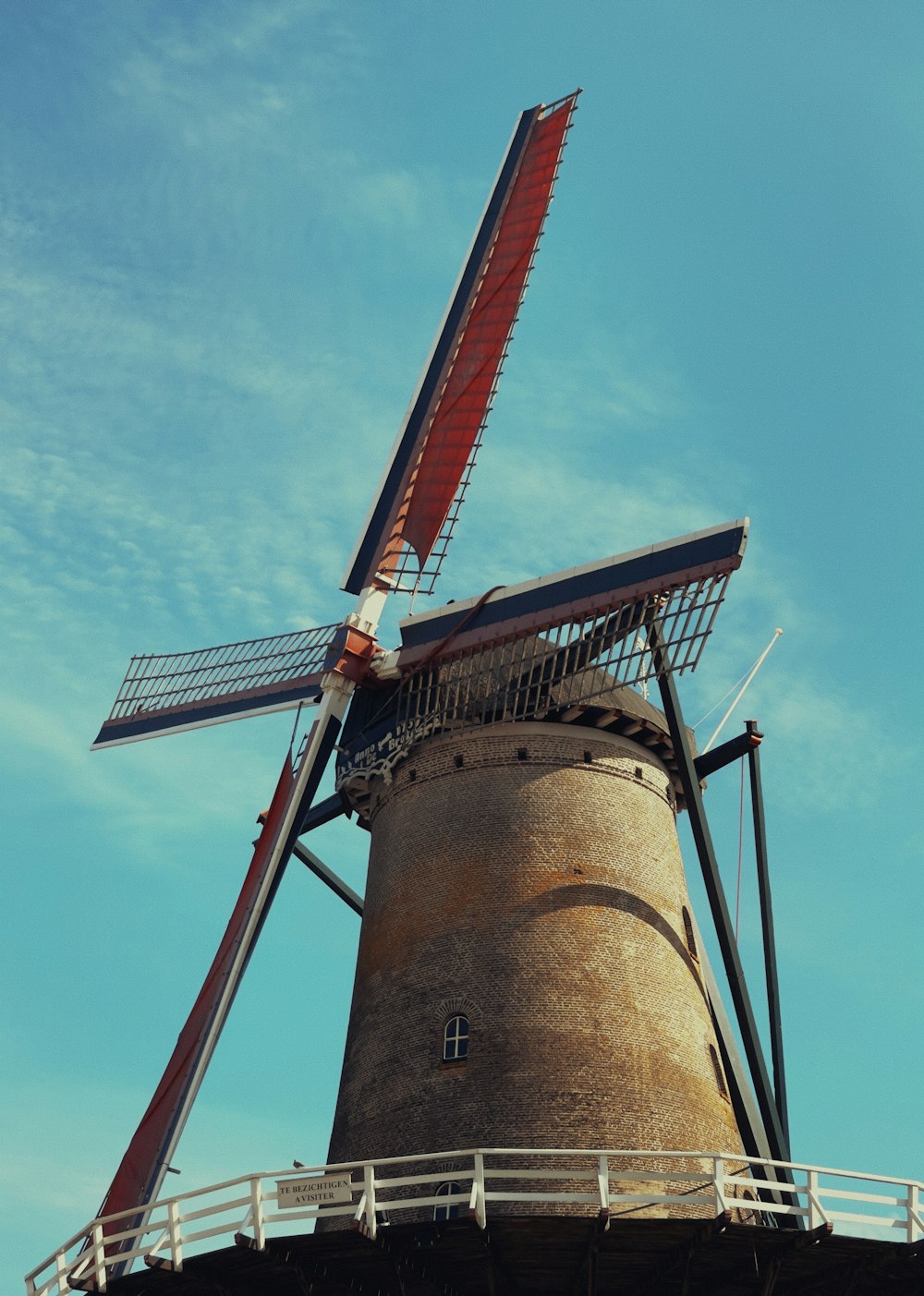 a windmill with a blue sky