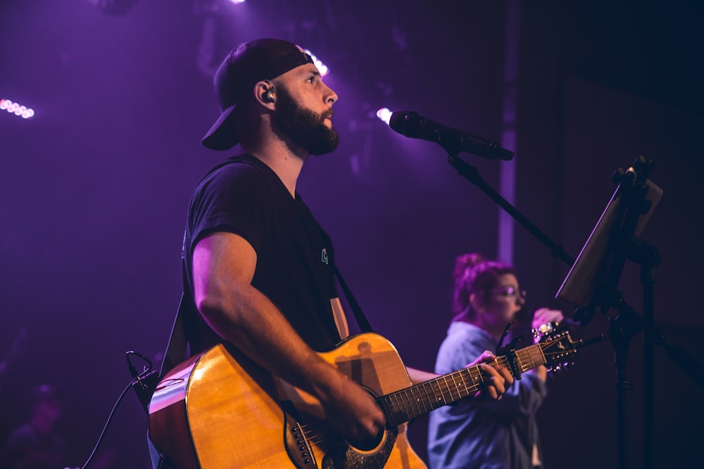 a man playing a guitar