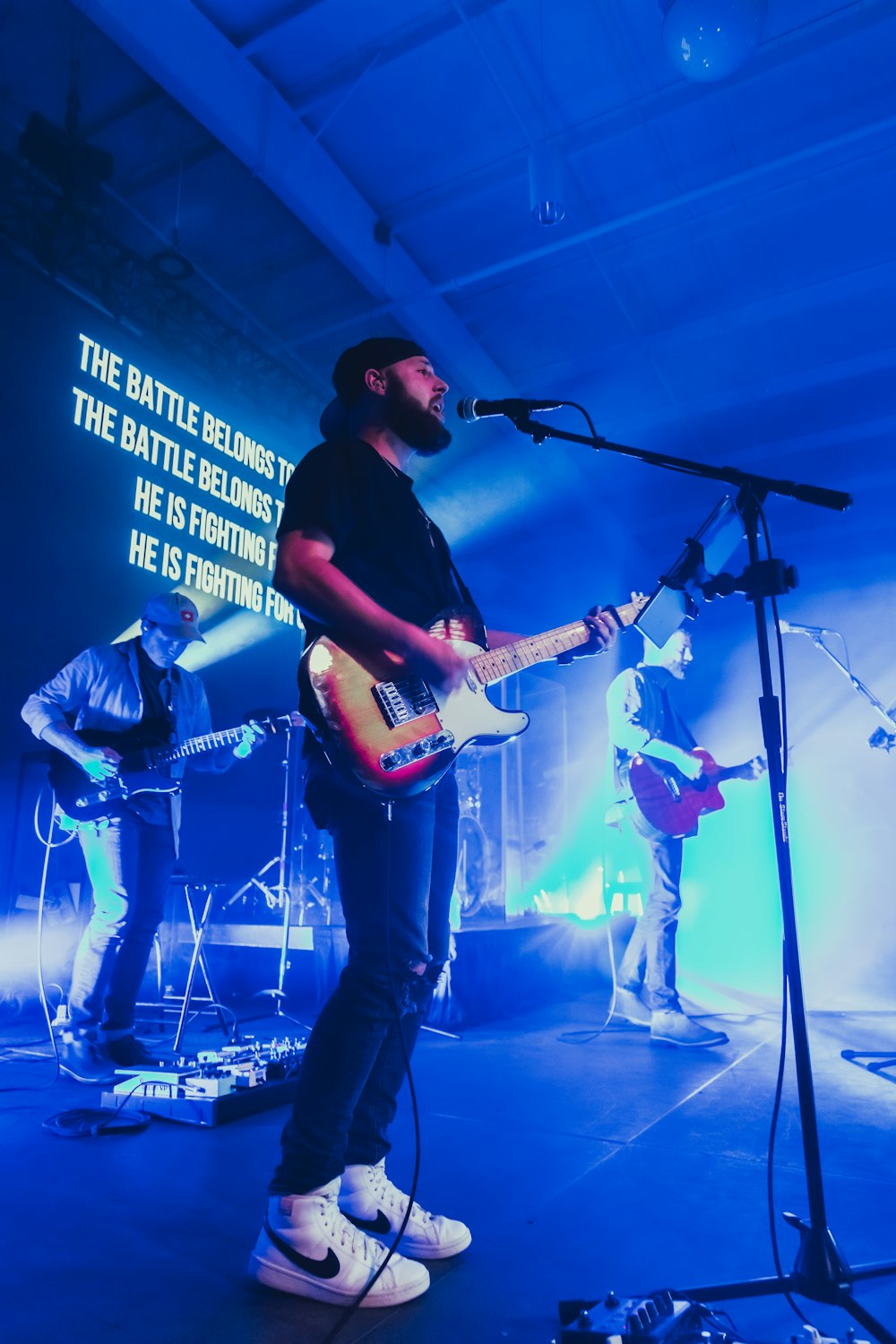 a group of people playing instruments on a stage