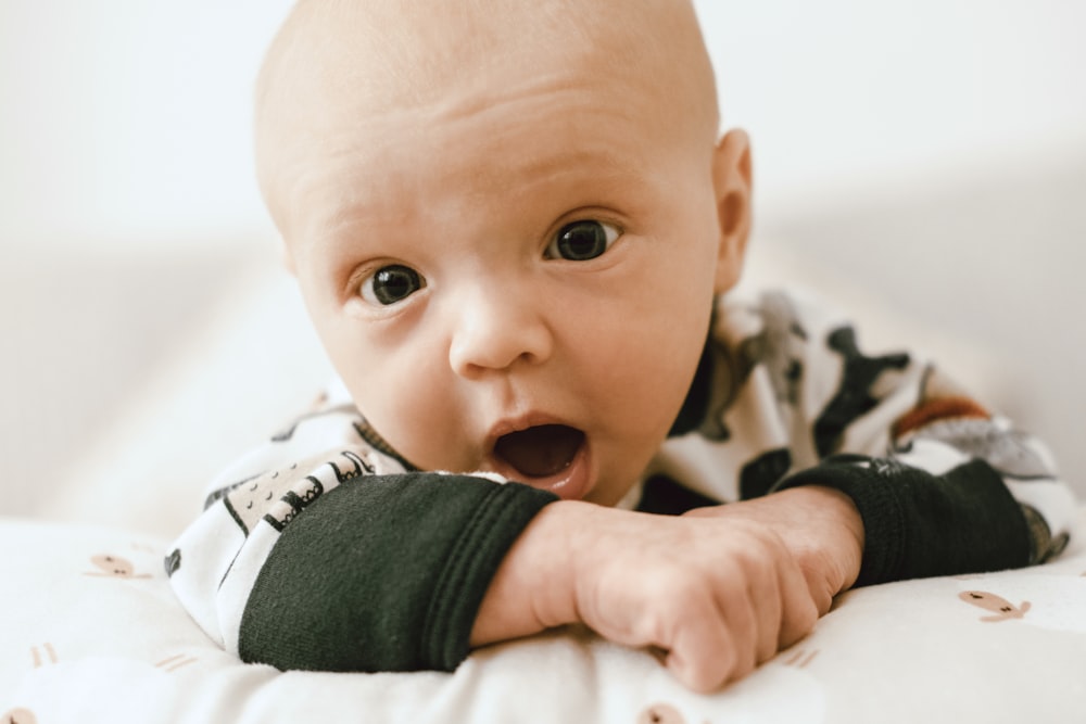 a baby with a surprised expression