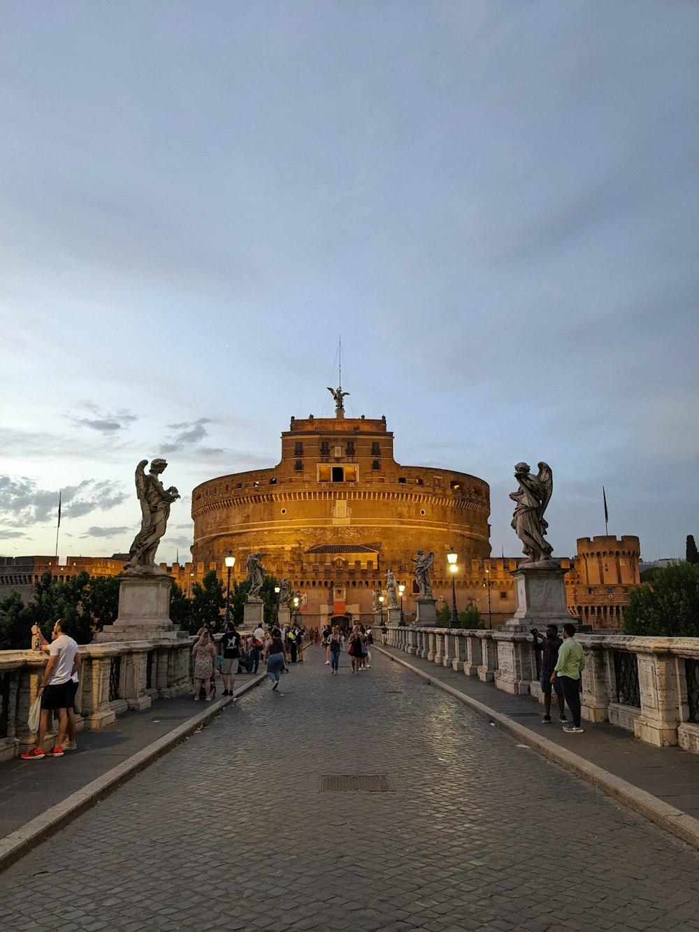 a large building with a statue in front of it