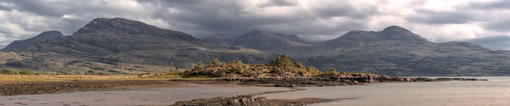 a landscape with mountains in the back