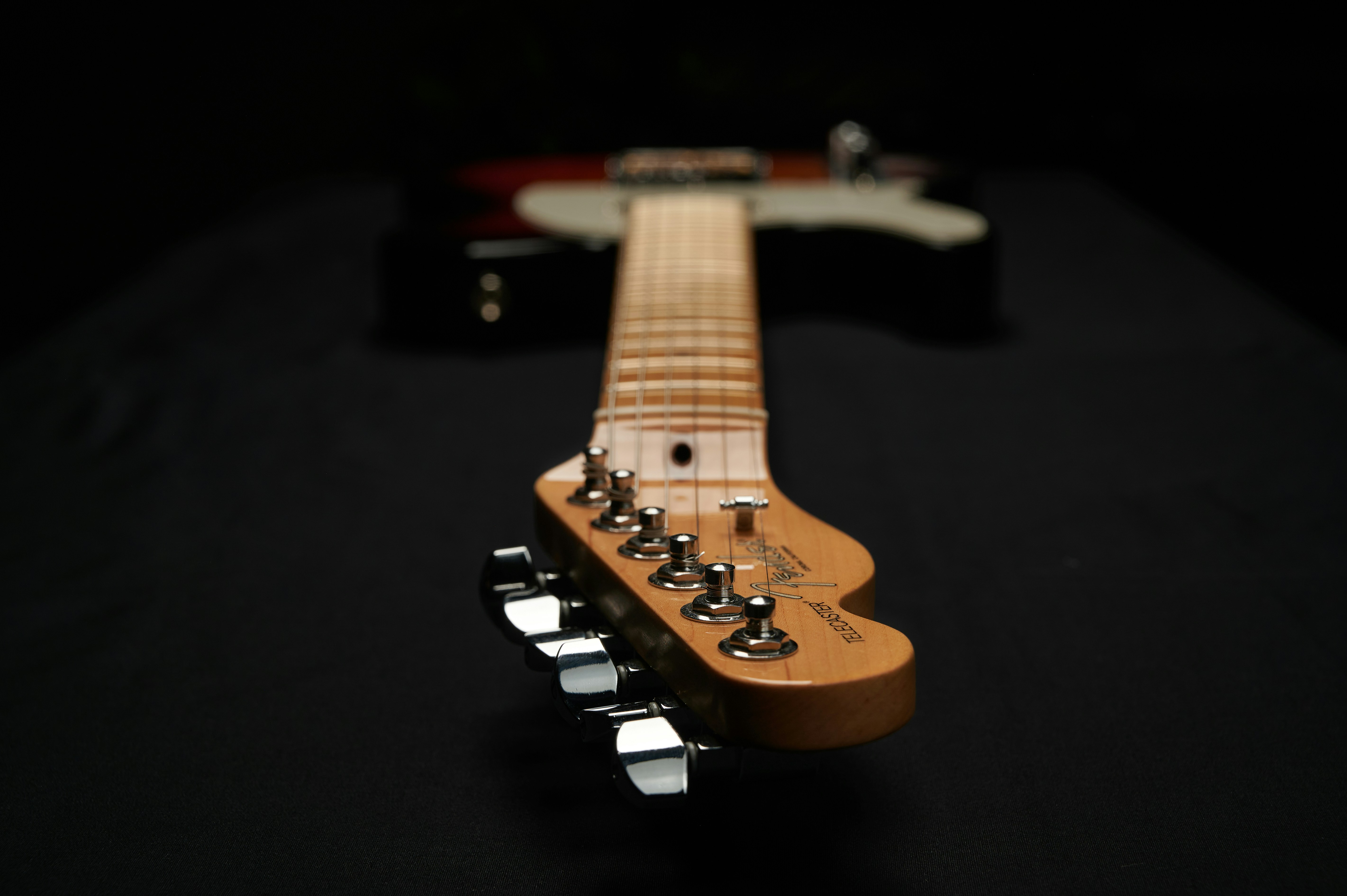 a guitar with a black background