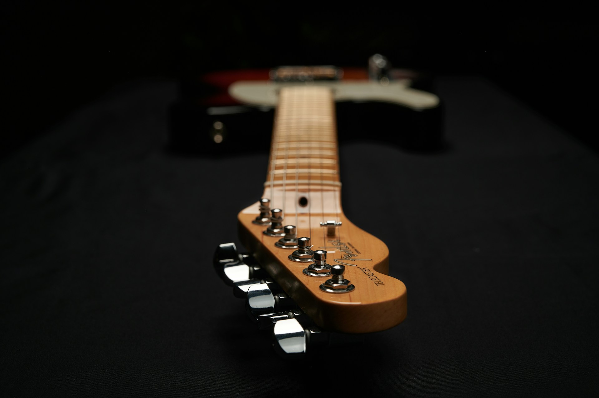 a guitar with a black background