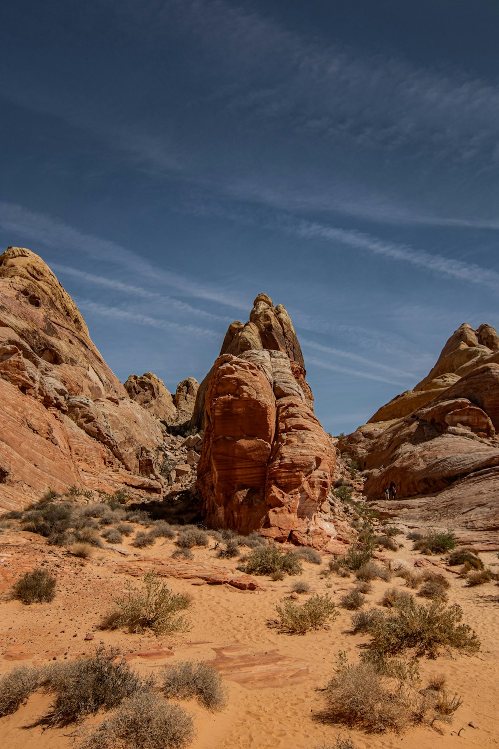 a desert landscape with a rock formation