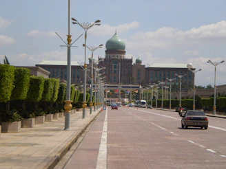 a street with cars and buildings along it