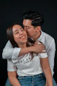 a man and woman kissing