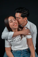 a man and woman kissing