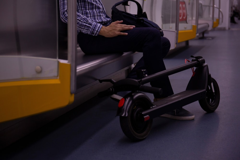 a man sitting on a cart