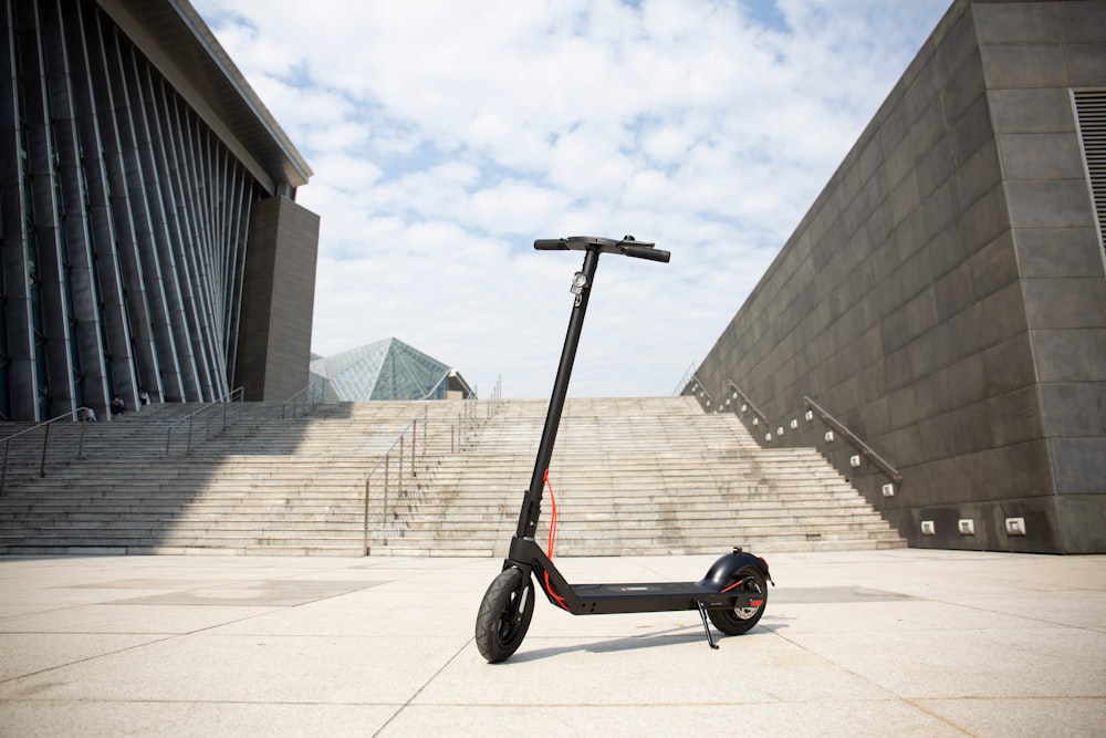 a scooter parked outside a building