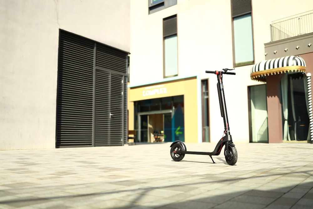 a scooter parked outside a building