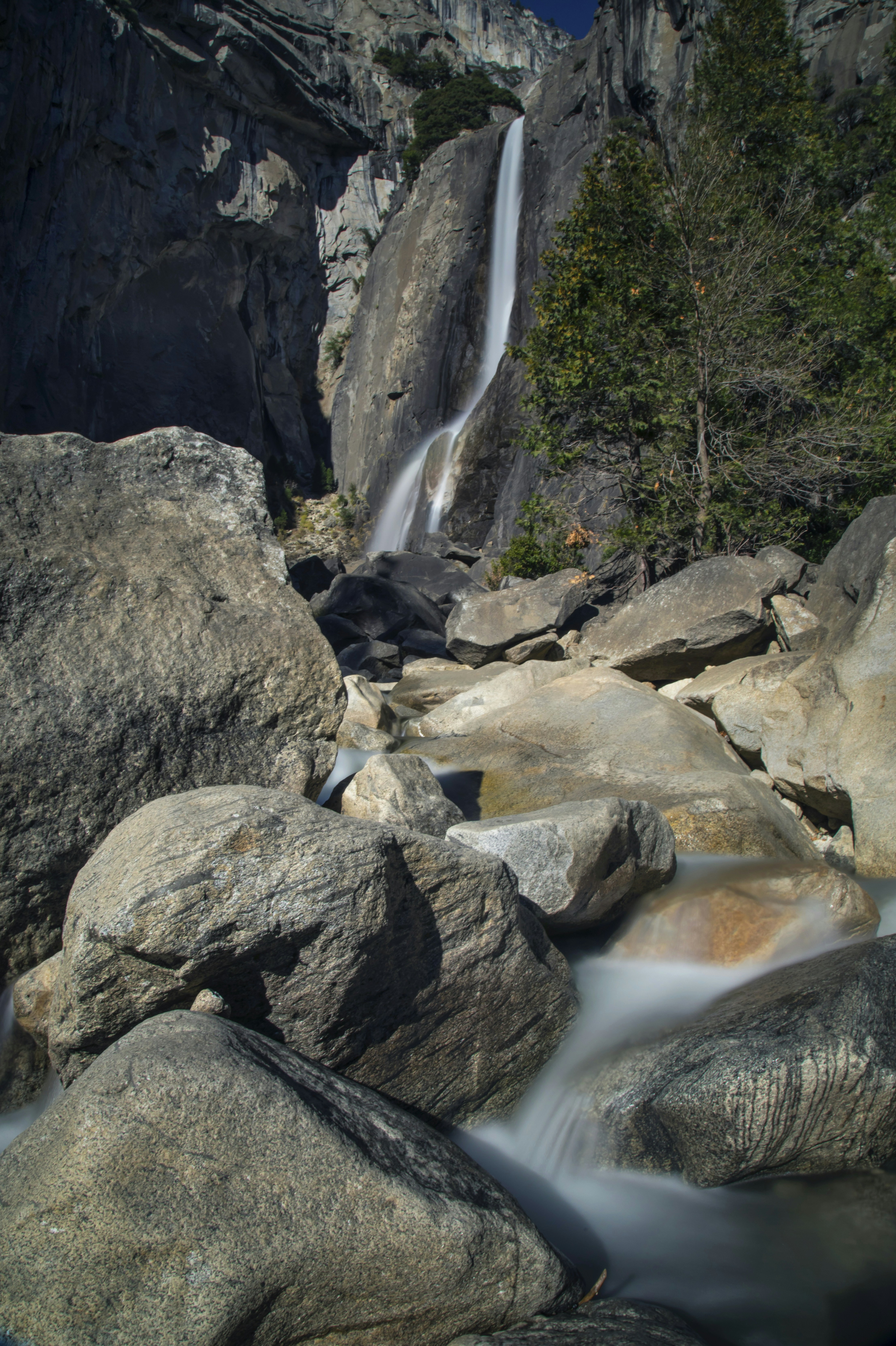 A waterfall over rocks photo – Free Grey Image on Unsplash