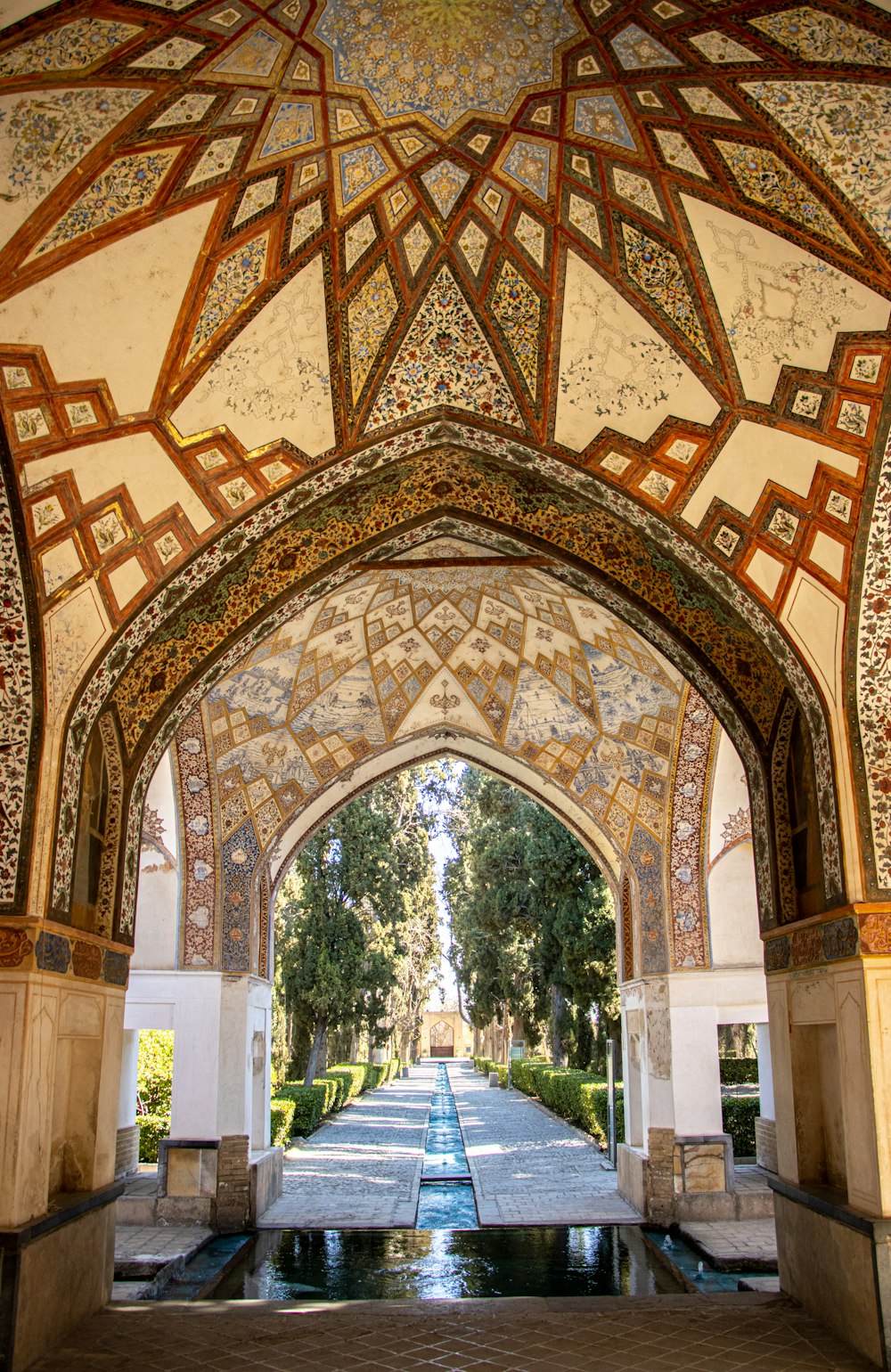 a large arched doorway with a pool